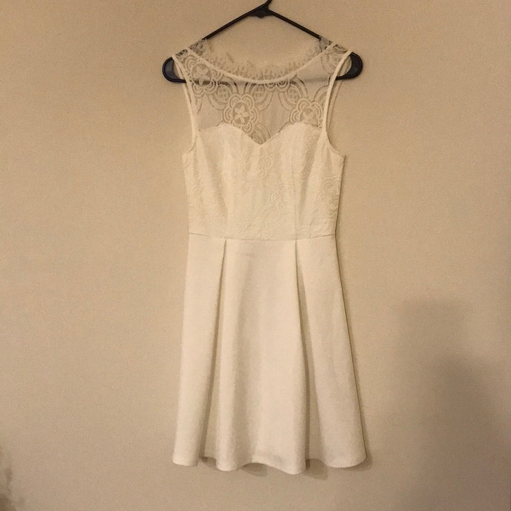 Francesca’s white dress. Worn once for wedding after party for a few hours
